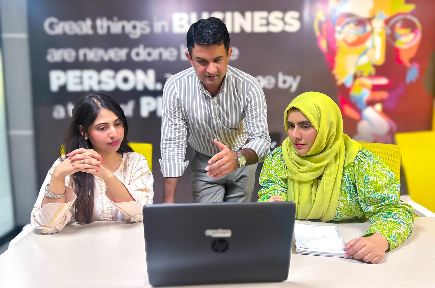 ropstam solutions employees discussing a project
